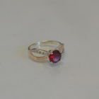 Срібна каблучка з золотими вставками