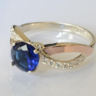 Срібна каблучка з золотими вставками