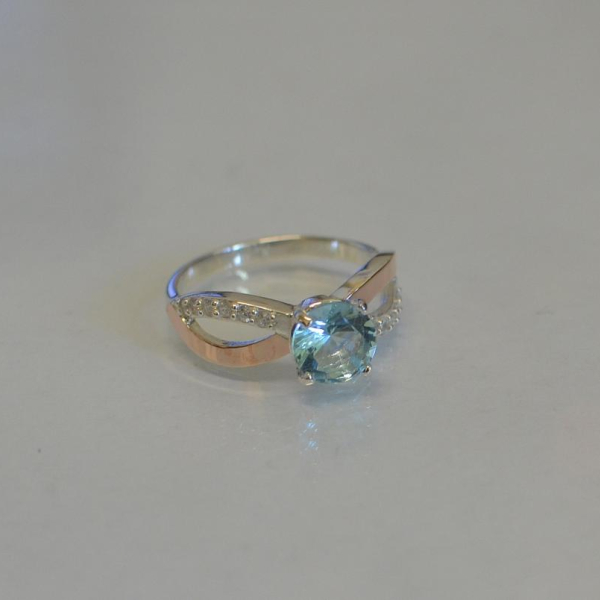 Срібна каблучка з золотими вставками