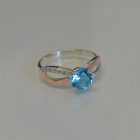 Срібна каблучка з золотими вставками