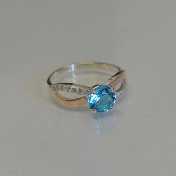 Срібна каблучка з золотими вставками