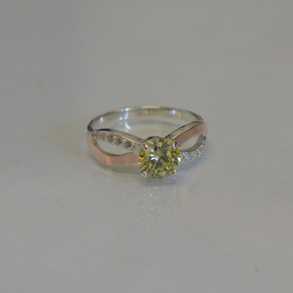 Срібна каблучка з золотими вставками