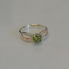 Срібна каблучка з золотими вставками