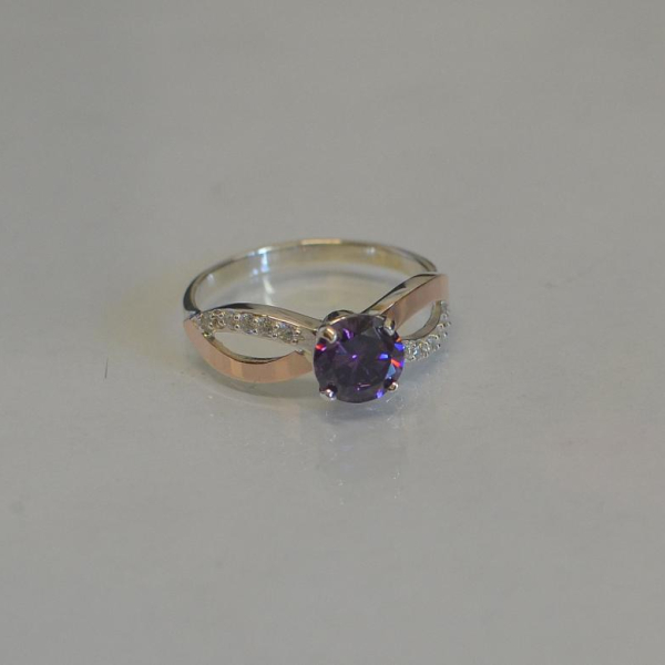 Срібна каблучка з золотими вставками