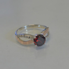 Срібна каблучка з золотими вставками