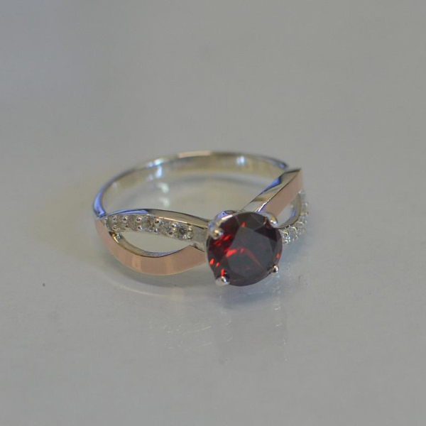 Срібна каблучка з золотими вставками