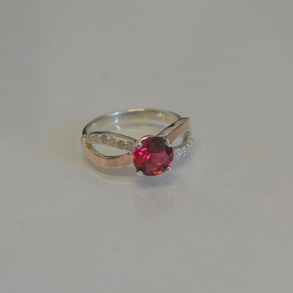 Срібна каблучка з золотими вставками