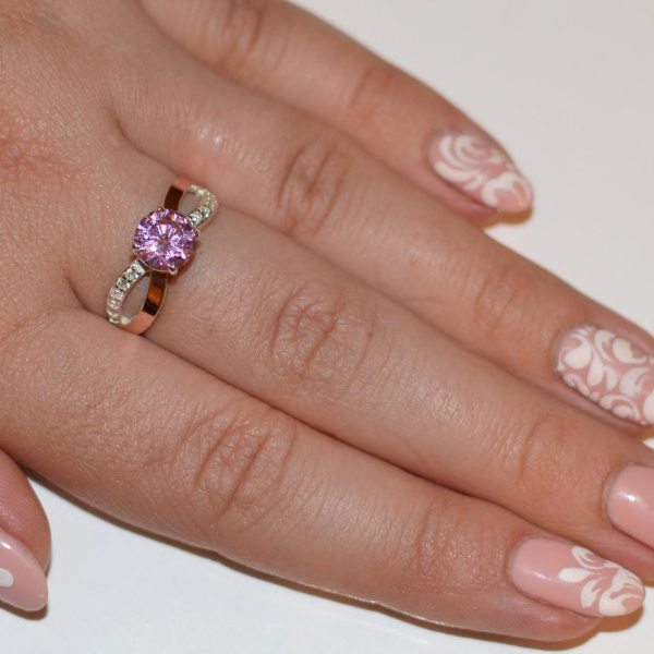 Срібна каблучка з золотими вставками