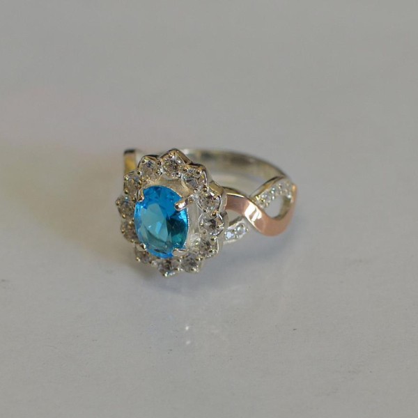 Срібна каблучка з золотими вставками