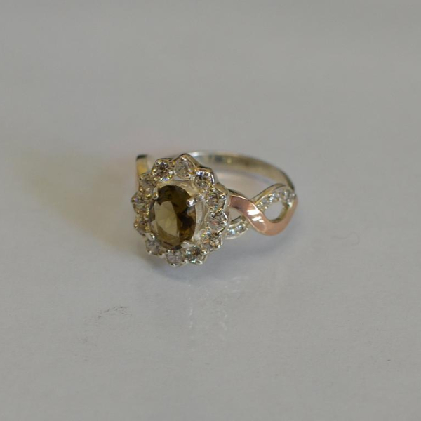 Срібна каблучка з золотими вставками