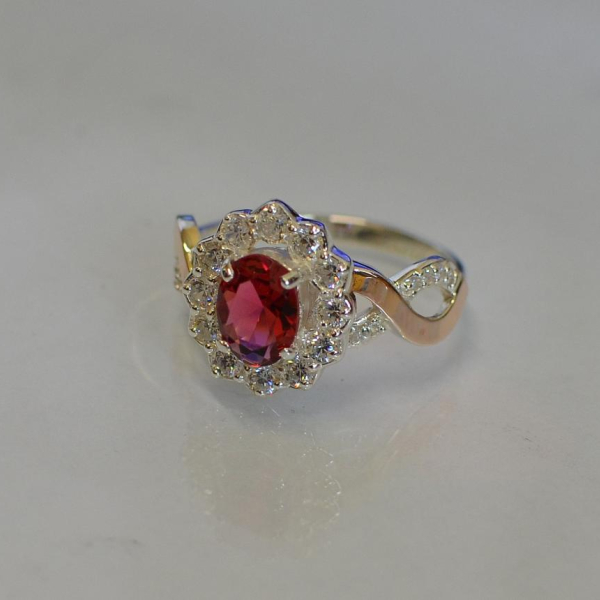 Срібна каблучка з золотими вставками