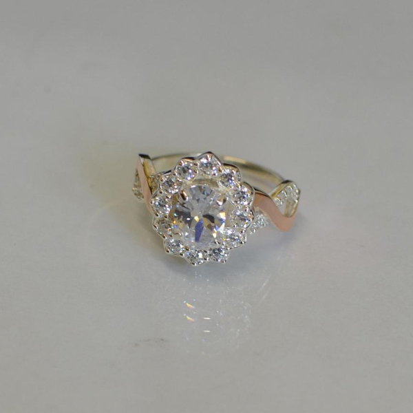 Срібна каблучка з золотими вставками