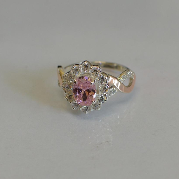 Срібна каблучка з золотими вставками