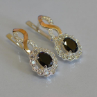 Срібні сережки з золотими напайками