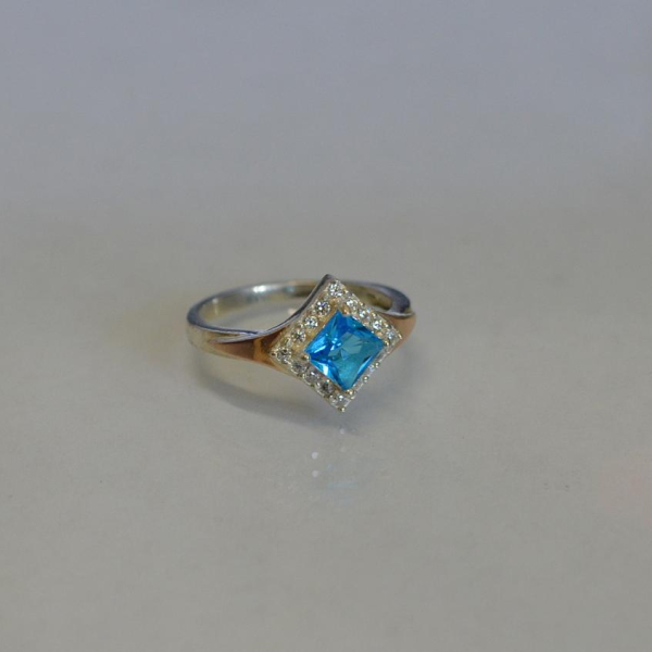 Срібна каблучка з накладками з золота