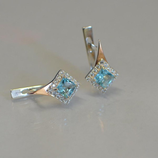 Срібні сережки з золотими напайками