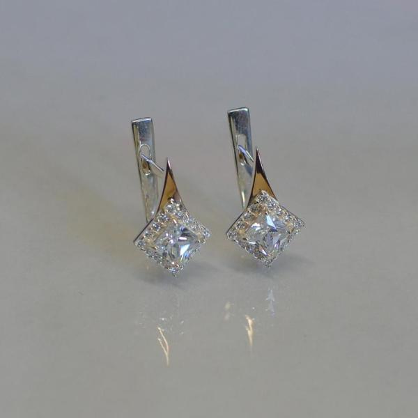 Срібні сережки з золотими напайками