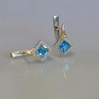 Срібні сережки з золотими напайками