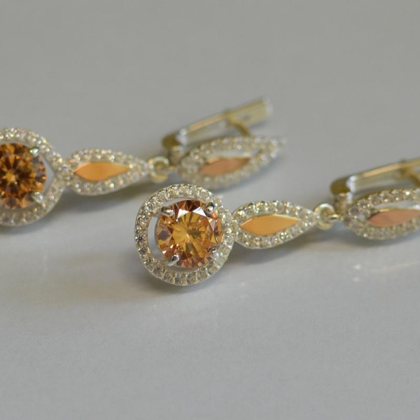 Срібні сережки з золотими пластинками