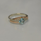 Срібне кільце з золотими вставками