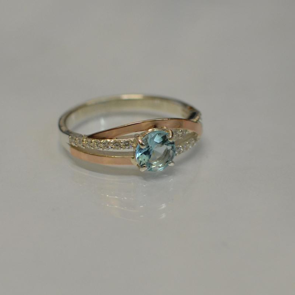 Срібне кільце з золотими вставками