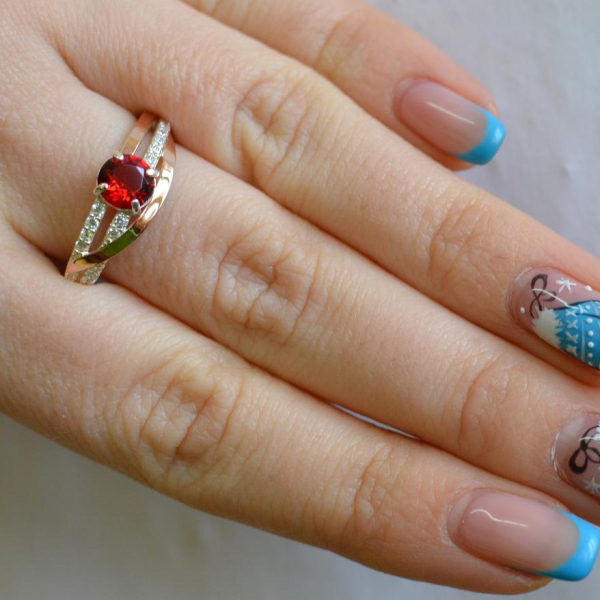 Срібне кільце з золотими вставками