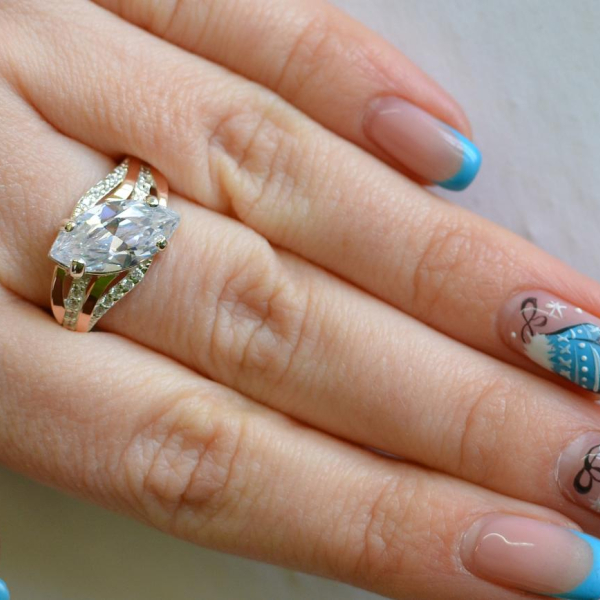 Срібна каблучка з золотими пластинами