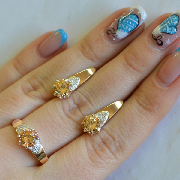 Срібний набір з золотими вставками