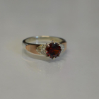 Срібна каблучка з золотими вставками