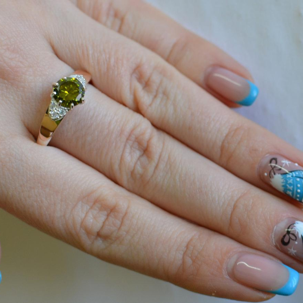 Срібна каблучка з золотими вставками