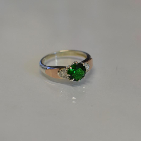 Срібна каблучка з золотими вставками