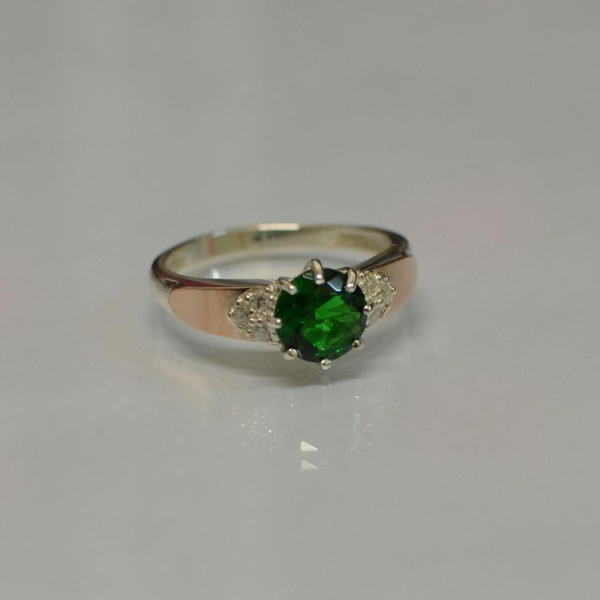 Срібна каблучка з золотими вставками