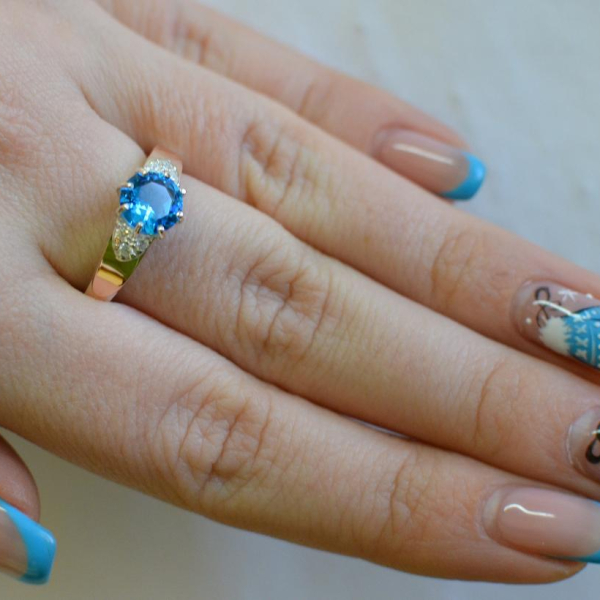 Срібна каблучка з золотими вставками