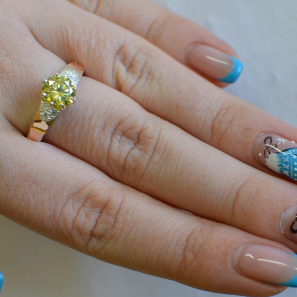 Срібна каблучка з золотими вставками