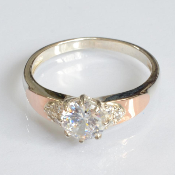 Срібна каблучка з золотими вставками