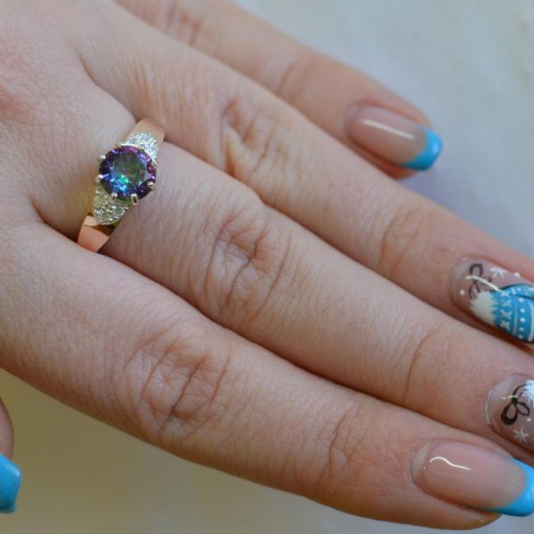 Срібна каблучка з золотими вставками