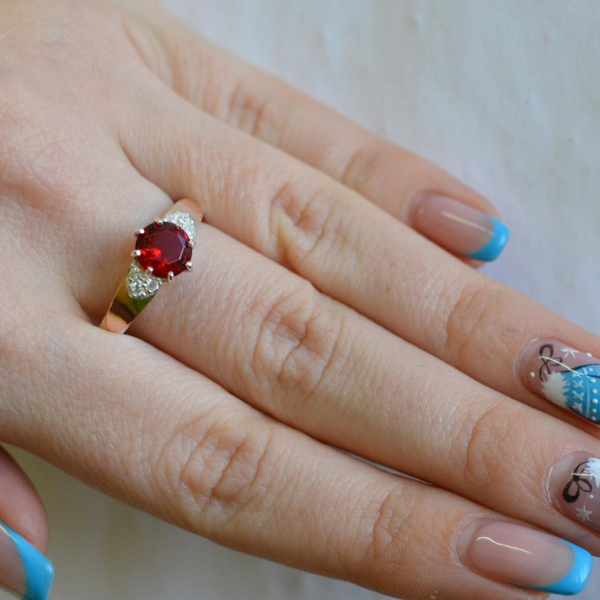 Срібна каблучка з золотими вставками