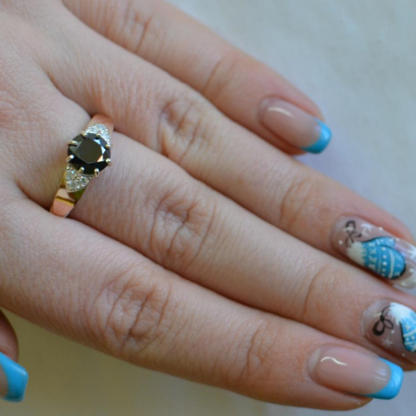 Срібна каблучка з золотими вставками