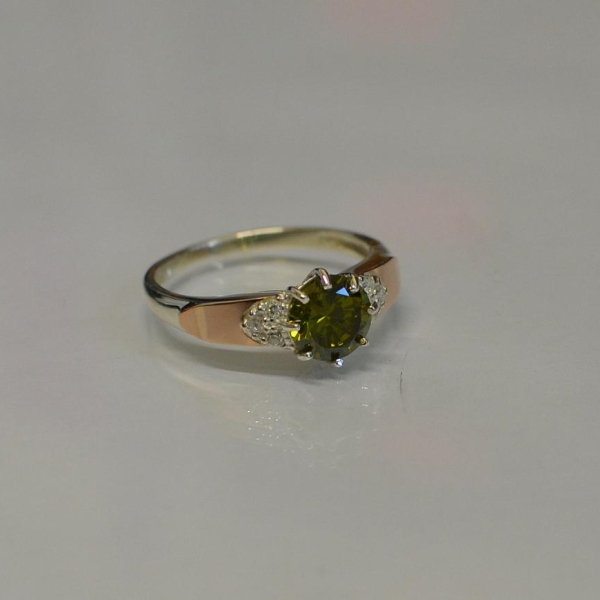 Срібна каблучка з золотими вставками