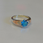 Срібна каблучка з золотими вставками