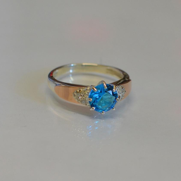 Срібна каблучка з золотими вставками