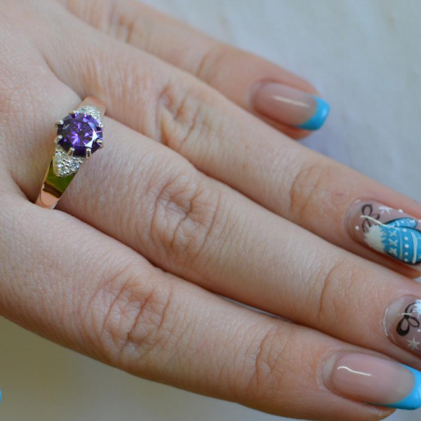 Срібна каблучка з золотими вставками