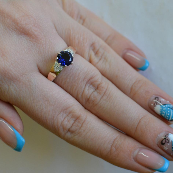 Срібна каблучка з золотими вставками