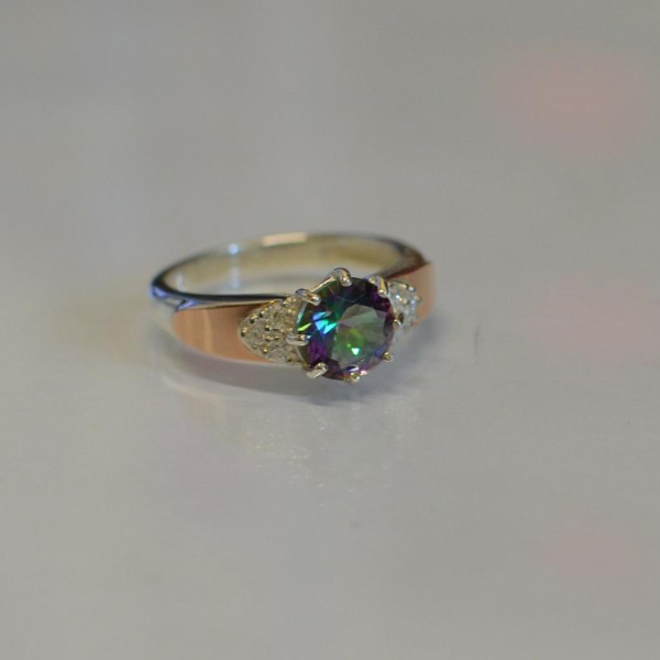 Срібна каблучка з золотими вставками