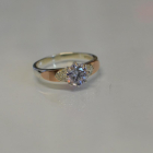 Срібна каблучка з золотими вставками