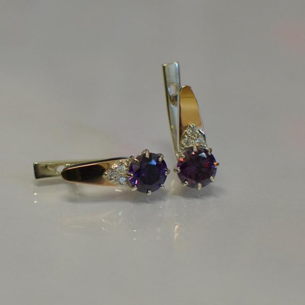 Срібні сережки з золотими вставками