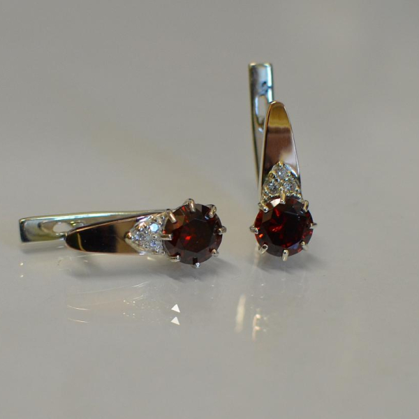 Срібні сережки з золотими вставками