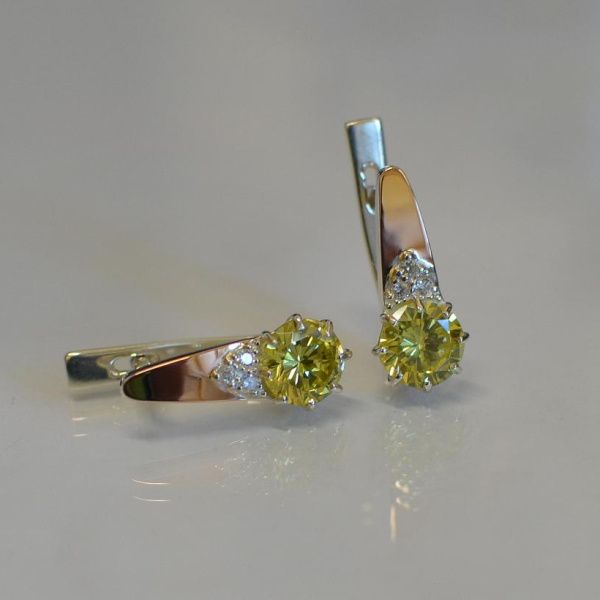 Срібні сережки з золотими вставками