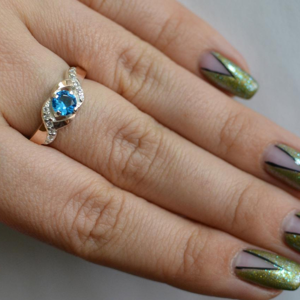 Серебряное кольцо с золотыми вставками