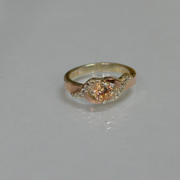 Серебряное кольцо с золотыми вставками